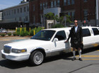 Tours by Towncar owner Jim Currie poses in Kilt and all by his signature limousine.